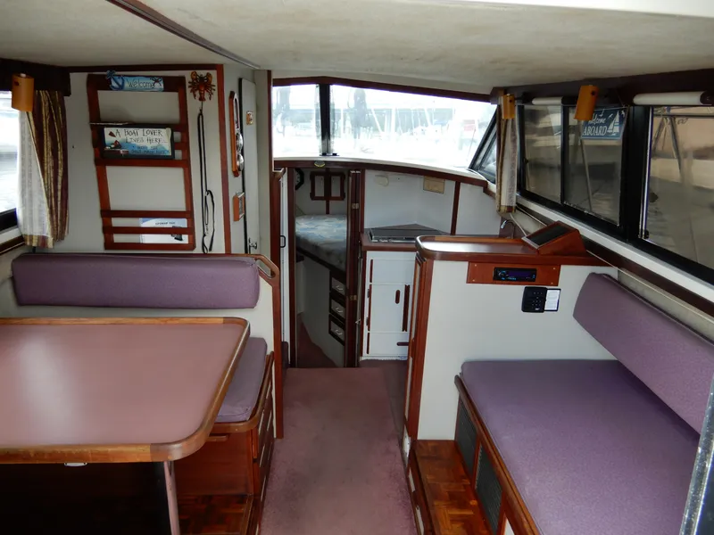 Slide: The Image of Interior of 1987 Carver 28 Mariner/Voyager boat with seating and cabin area. - 24