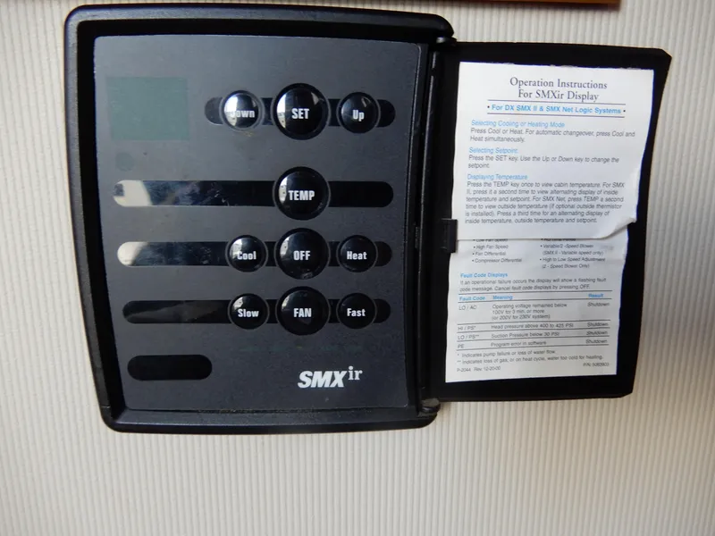 Slide: The Image of Thermostat control panel with operation instructions for SMXir display on a 1987 Carver 28 Mariner. - 32
