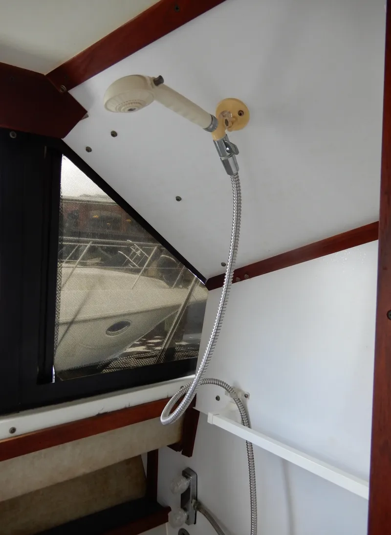 Slide: The Image of 1987 Carver 28 Mariner Voyager interior shower area with window view. - 46