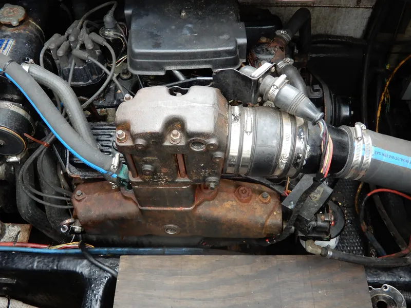 Slide: The Image of Engine of 1987 Carver 28 Mariner/Voyager boat, showing hoses and components. - 49