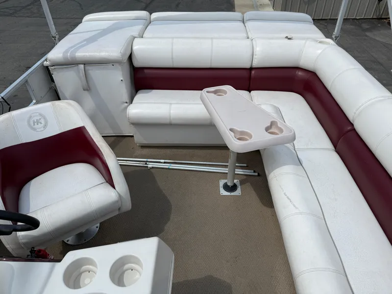 Slide: The Image of Interior of 2000 Harris 200 Super Sunliner pontoon boat with white and maroon seating. - 10