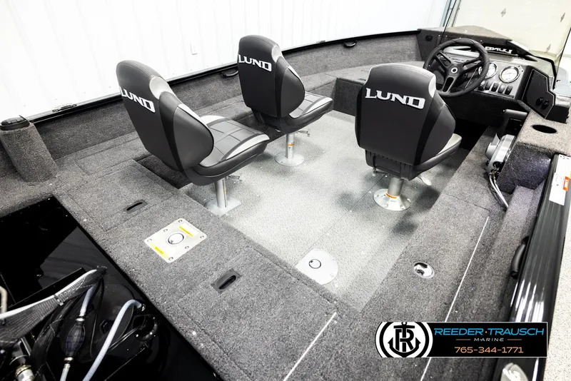 Slide: The Image of 2026 Lund 1650 Rebel XL SS boat interior with two swivel seats and steering console. - 10