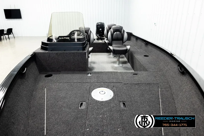 Slide: The Image of 2026 Lund 1650 Rebel XL SS boat interior with seating and steering console. - 11