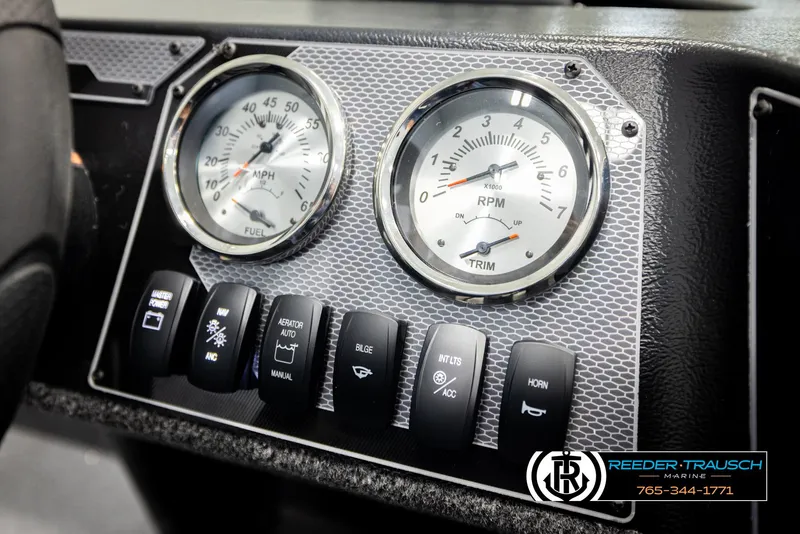 Slide: The Image of Dashboard of 2026 Lund 1650 Rebel XL SS boat with gauges and control switches. - 28