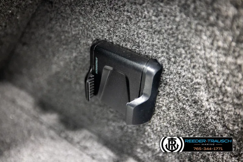 Slide: The Image of Interior detail of 2026 Lund 1650 Rebel XL SS boat with carpeted surface and clip. - 29