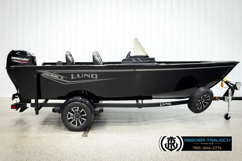 Slide: The Image of 2026 Lund 1650 Rebel XL SS boat on trailer, side view, black exterior. - 3