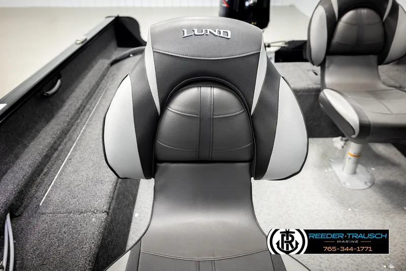 Slide: The Image of 2026 Lund 1650 Rebel XL SS boat seat, gray and black design, Reeder-Trausch Marine logo. - 32