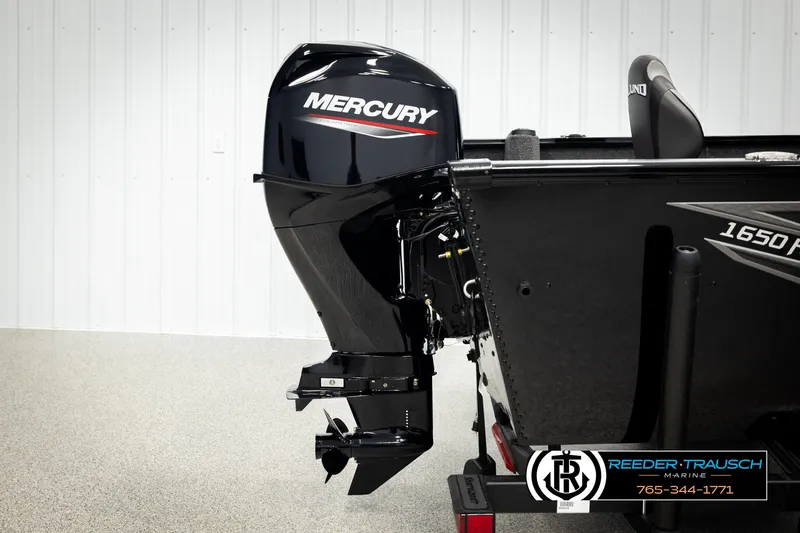Slide: The Image of 2026 Lund 1650 Rebel XL SS boat with Mercury outboard motor in showroom. - 39