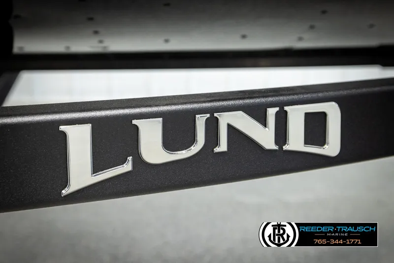 Slide: The Image of 2026 Lund 1650 Rebel XL SS logo on boat trailer, Reeder-Trausch Marine branding. - 44