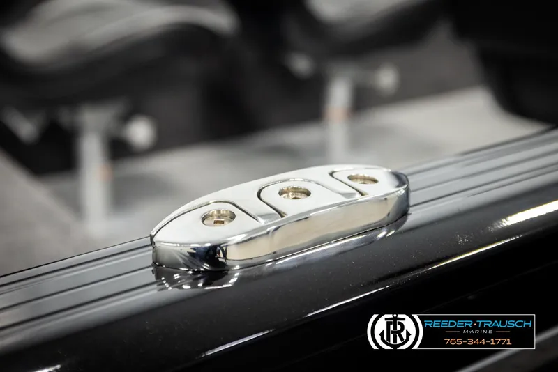 Slide: The Image of 2026 Lund 1650 Rebel XL SS boat cleat detail, Reeder-Trausch Marine branding visible. - 47