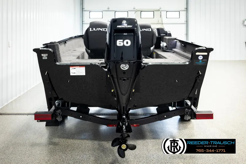 Slide: The Image of 2026 Lund 1650 Rebel XL SS boat with Mercury 60 engine in showroom. - 5