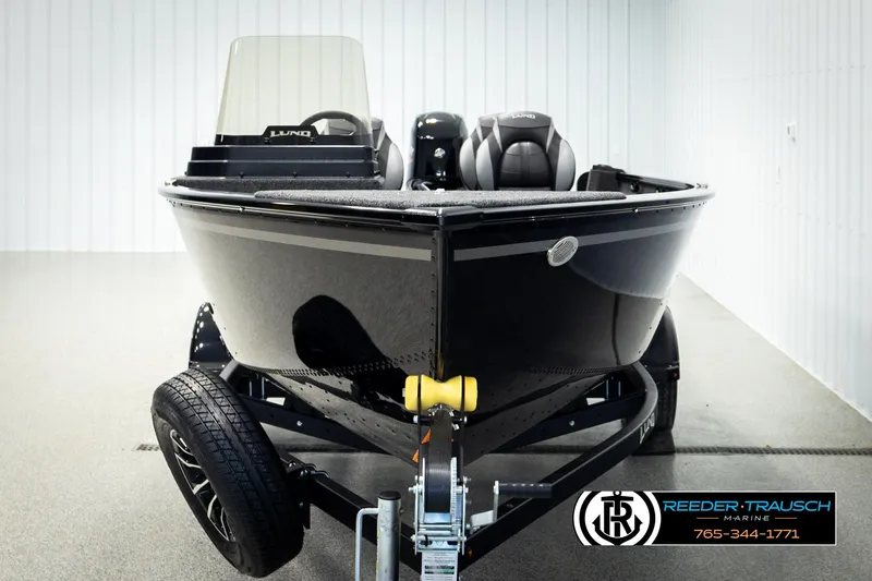Slide: The Image of 2026 Lund 1650 Rebel XL SS boat on trailer in showroom. - 6