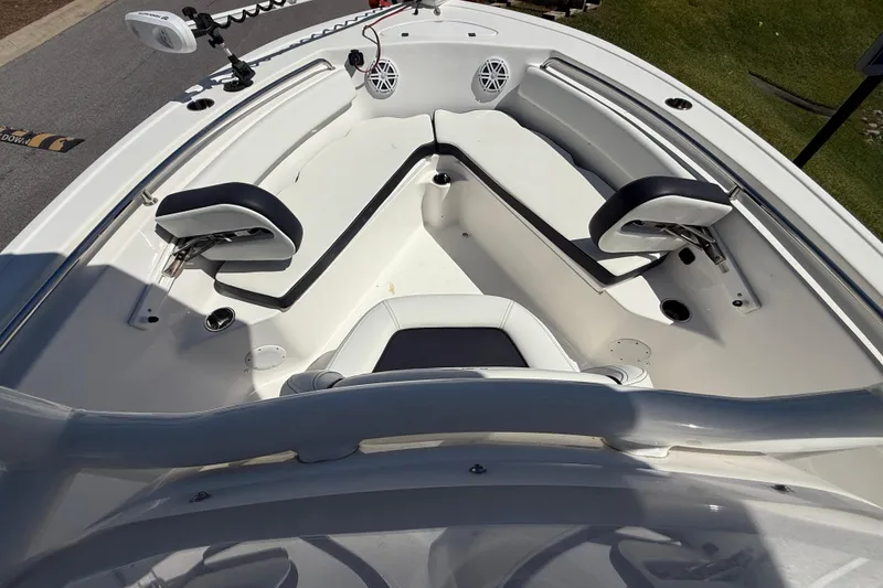 Slide: The Image of 2023 Tidewater 210 LXF boat interior with seating and speakers. - 17