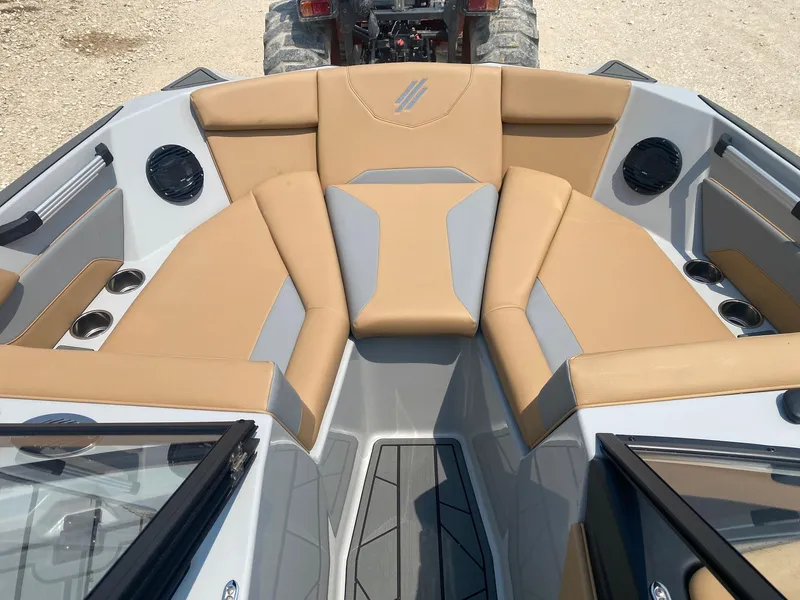 Slide: The Image of 2026 ATX Surf Boats 20 Type-S interior with tan and gray seating. - 10