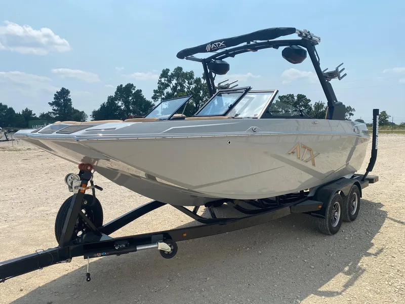 Slide: The Image of 2026 ATX Surf Boats 20 Type-S on trailer, parked outdoors under clear sky. - 2