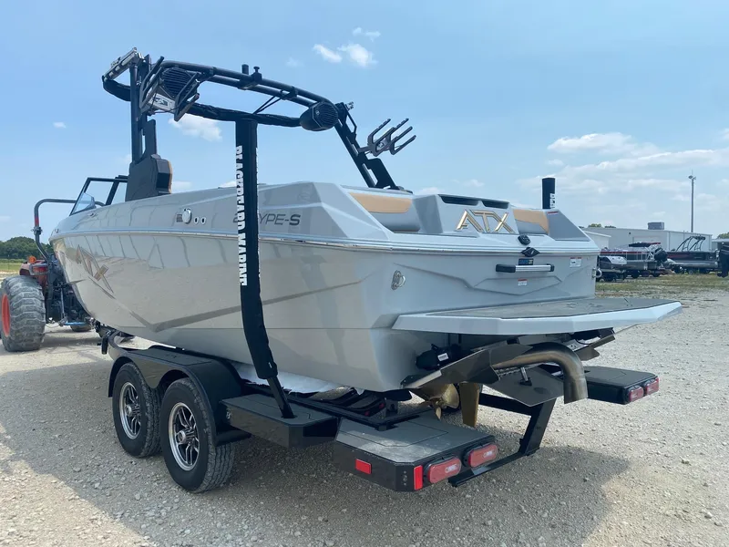 Slide: The Image of 2026 ATX Surf Boats 20 Type-S on trailer, rear view, outdoors. - 3