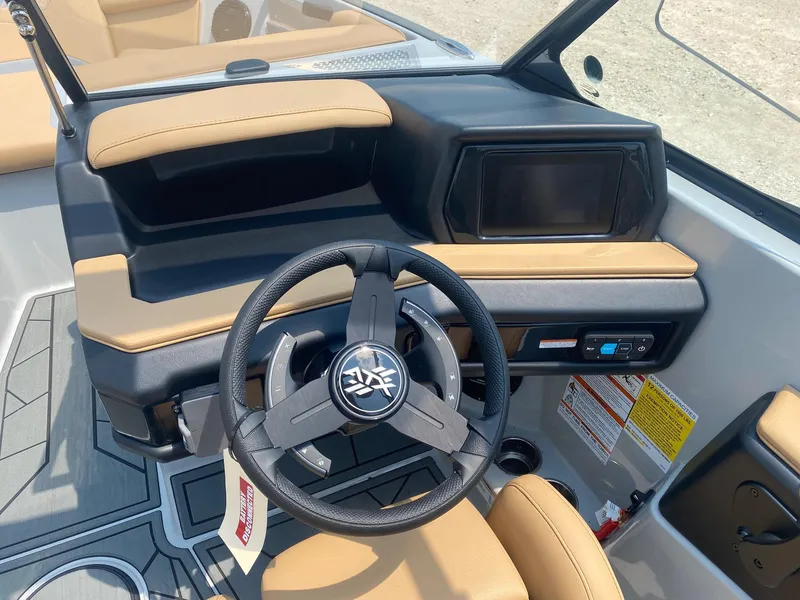 Slide: The Image of 2026 ATX Surf Boats 20 Type-S dashboard with steering wheel and control panel. - 7