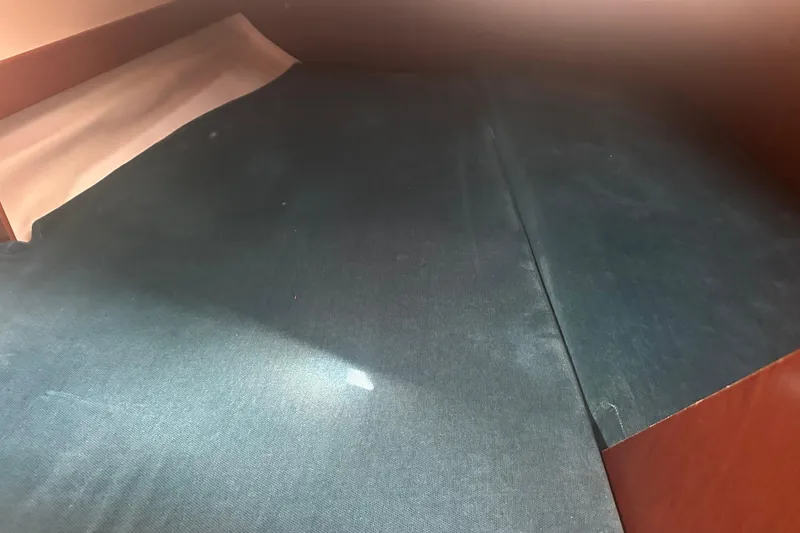 Slide: The Image of Interior cabin of 1998 Beneteau Oceanis 352 sailboat with blue upholstery. - 24