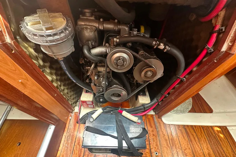 Slide: The Image of Engine compartment of a 1998 Beneteau Oceanis 352 sailboat, showing mechanical components. - 27