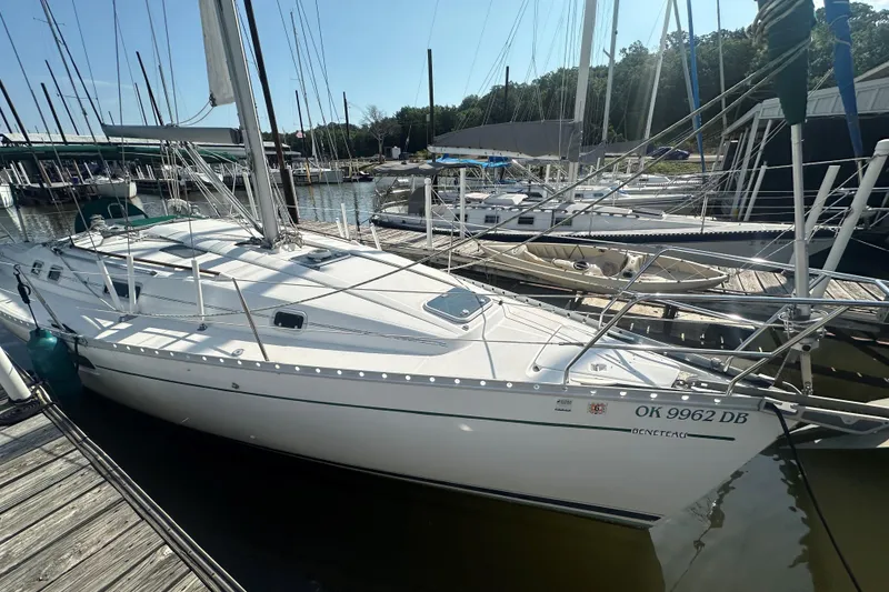 Slide: The Image of 1998 Beneteau Oceanis 352 sailboat docked at a marina on a sunny day. - 3