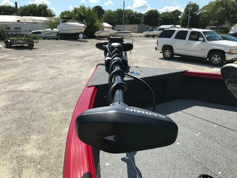 Slide: The Image of Red 2026 Lund 1800 Explorer SS boat with Garmin equipment, parked outdoors. - 17