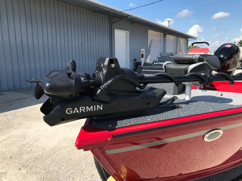 Slide: The Image of 2026 Lund 1800 Explorer SS dashboard with Garmin GPS and speedometer in a sunny outdoor setting. - 18