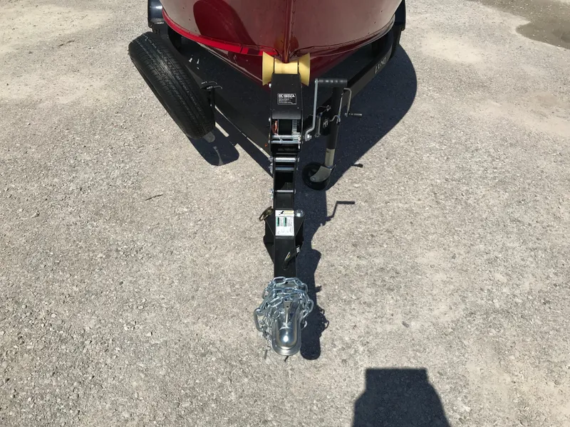 Slide: The Image of 2026 Lund 1800 Explorer SS with Mercury 115 Pro XS outboard motor, parked outdoors. - 5