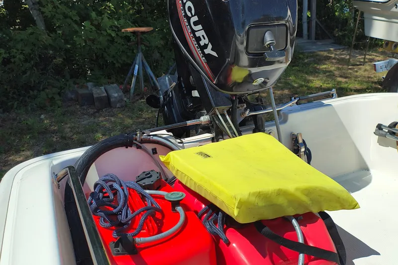 Slide: The Image of 2016 Boston Whaler 130 Super Sport boat with Mercury engine and safety equipment. - 7