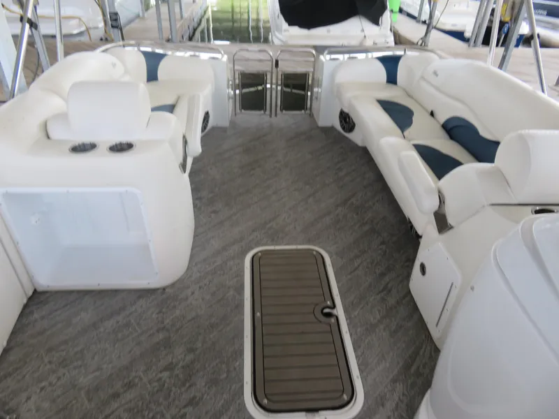 Slide: The Image of 2021 JC SportToon 24 TT CS boat interior with plush seating and modern design. - 5