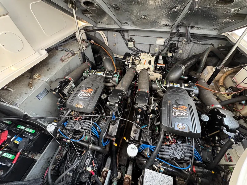 Slide: The Image of Engine compartment of a 2003 Sea Ray 320 Sundancer boat, showcasing dual engines. - 19