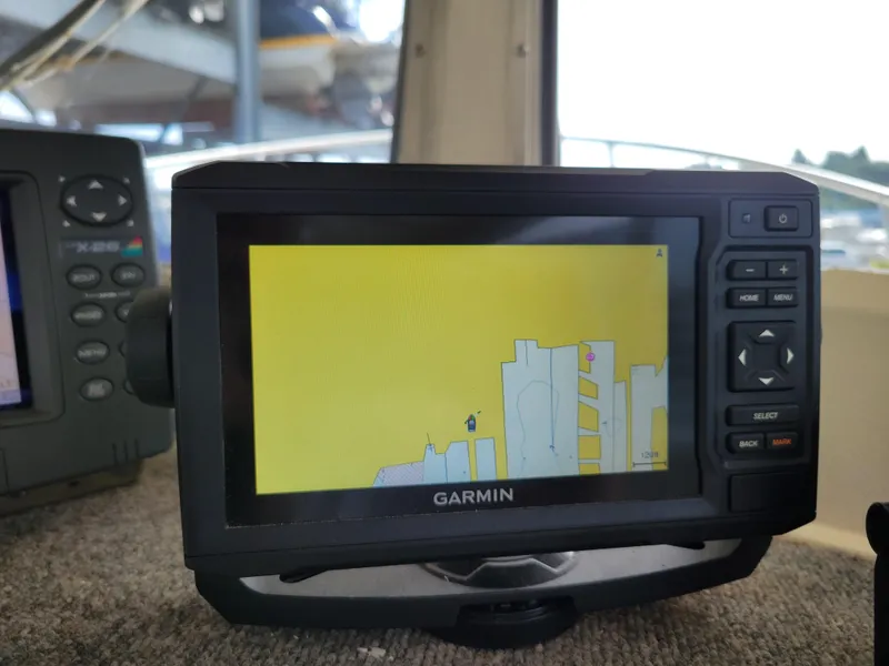 Slide: The Image of Garmin GPS display on 1999 SeaSport 2400 XL Limited boat dashboard. - 16