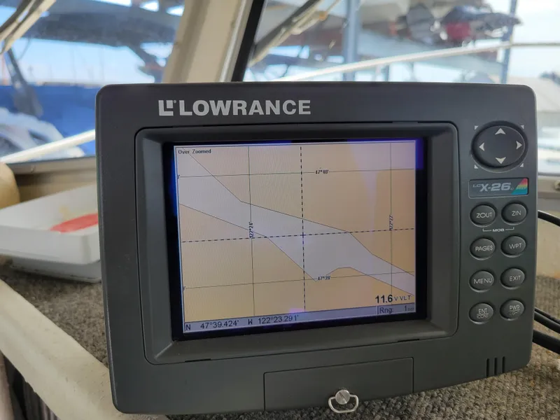 Slide: The Image of Lowrance GPS device on 1999 SeaSport 2400 XL Limited boat, displaying navigational map. - 18