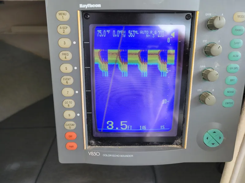 Slide: The Image of Raytheon V850 color echo sounder display on 1999 SeaSport 2400 XL Limited boat. - 20