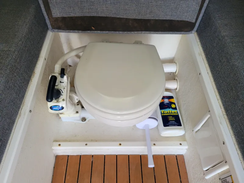 Slide: The Image of Marine toilet in 1999 SeaSport 2400 XL Limited boat with Jabsco pump and cleaner. - 30