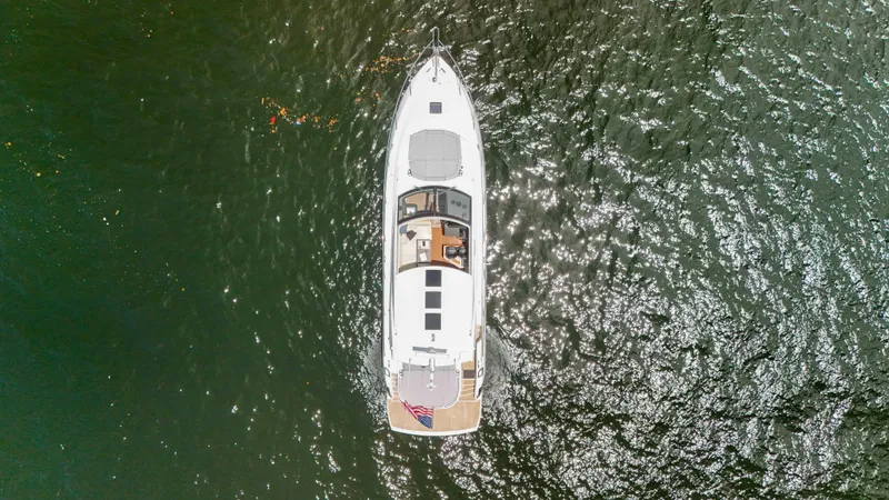 Slide: The Image of Aerial view of 2017 Sunseeker Predator 57 yacht on shimmering water. - 12