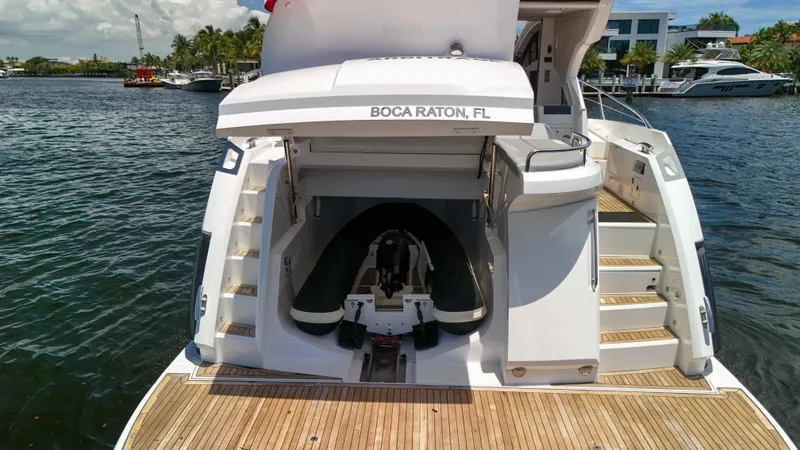 Slide: The Image of 2017 Sunseeker Predator 57 yacht with tender garage, docked in Boca Raton, FL. - 15