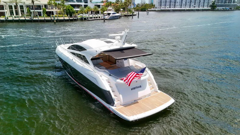Slide: The Image of 2017 Sunseeker Predator 57 yacht cruising on a sunny day, displaying an American flag. - 23