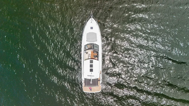 Slide: The Image of Aerial view of 2017 Sunseeker Predator 57 yacht on shimmering water. - 24