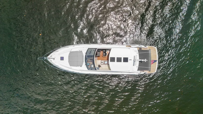 Slide: The Image of Aerial view of 2017 Sunseeker Predator 57 yacht on shimmering water. - 26