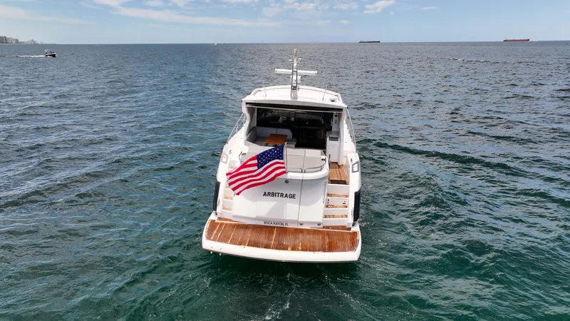 Slide: The Image of 2017 Sunseeker Predator 57 yacht on open sea with American flag. - 28