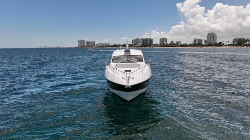 Slide: The Image of 2017 Sunseeker Predator 57 yacht on ocean near city skyline. - 33