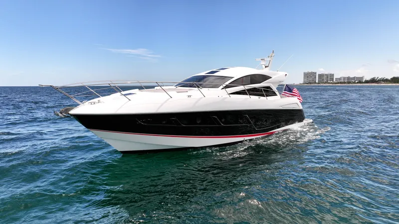 Slide: The Image of 2017 Sunseeker Predator 57 yacht cruising on open water, clear sky background. - 34