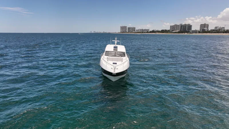 Slide: The Image of Sunseeker Predator 57 yacht on open water, 2017 model, with coastal skyline in background. - 39