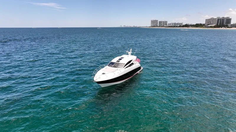 Slide: The Image of 2017 Sunseeker Predator 57 yacht on open sea near coastline, clear sky. - 44