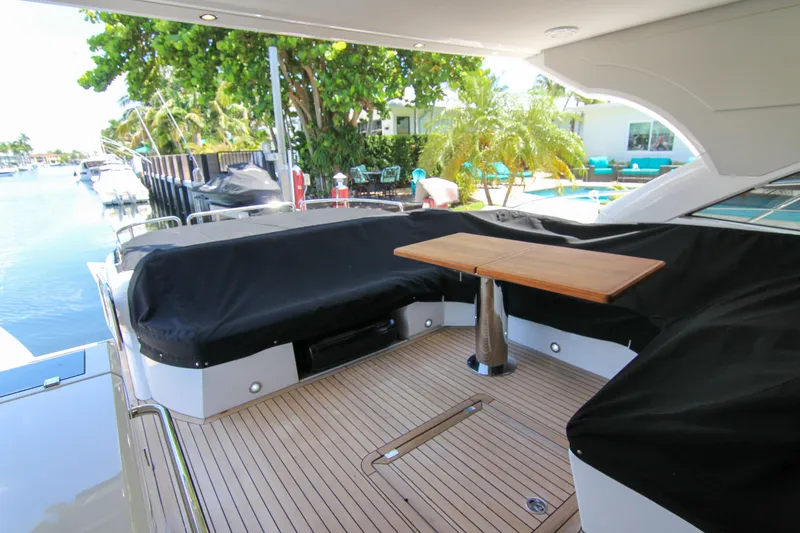 Slide: The Image of Luxurious Sunseeker Predator 57 yacht deck with seating and table, 2017 model. - 48