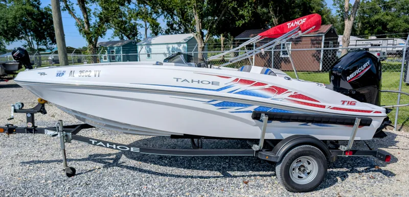 The Image of 2022 Tahoe T16 boat on trailer, featuring sleek design and vibrant graphics. - 1