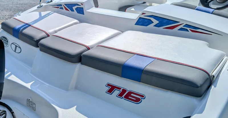 Slide: The Image of 2022 Tahoe T16 boat with cushioned seating and patriotic design accents. - 5