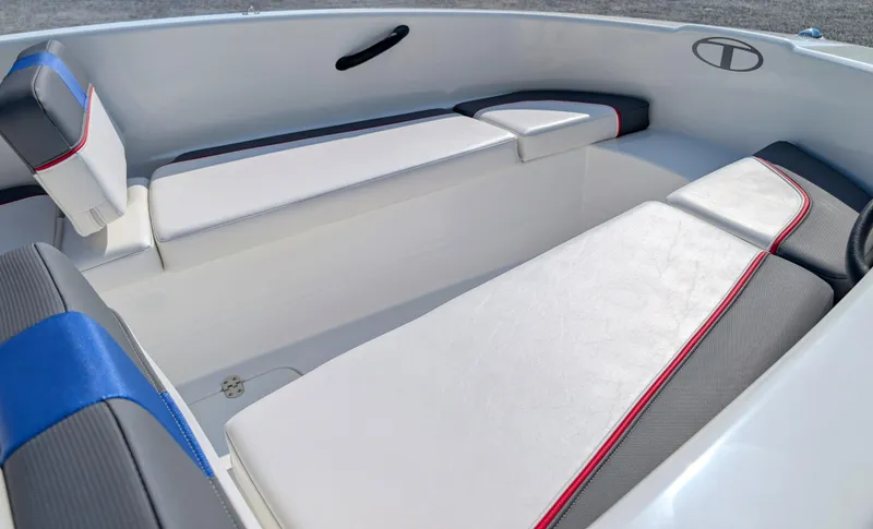 Slide: The Image of 2022 Tahoe T16 boat interior with white and gray seating, accented by red and blue trim. - 6