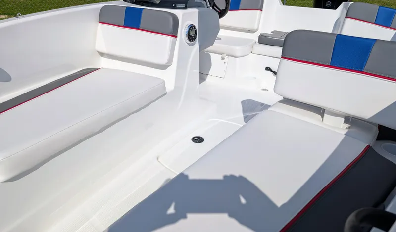 Slide: The Image of Interior of 2022 Tahoe T16 boat with white seating and blue accents. - 7
