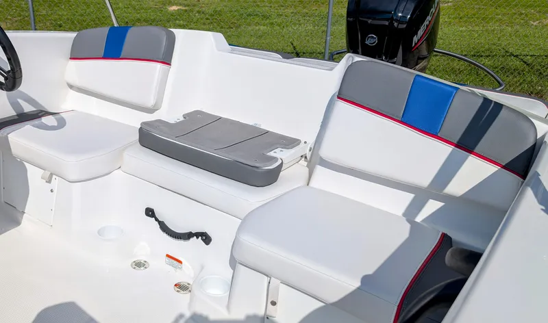 Slide: The Image of 2022 Tahoe T16 boat interior with white and gray seating, blue accents, and Mercury engine. - 8